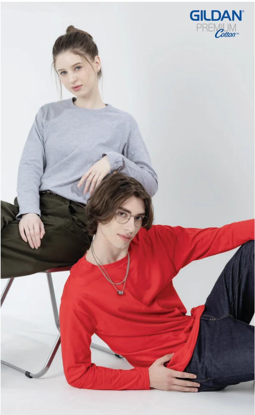 A woman in a sport grey and a man in a red Gildan 76400 long sleeve tee