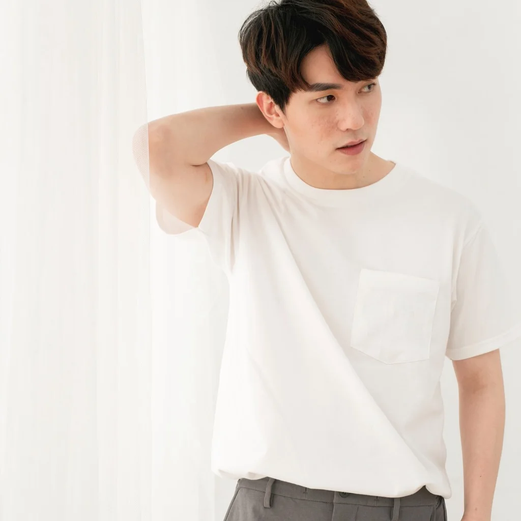 A man in a white Gildan Hammer HA30 pocket tee