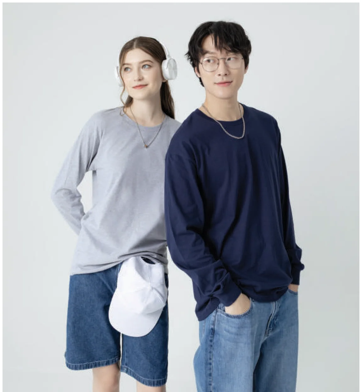 Two people wearing Gildan Hammer HA40 long sleeve tees in sport grey and navy