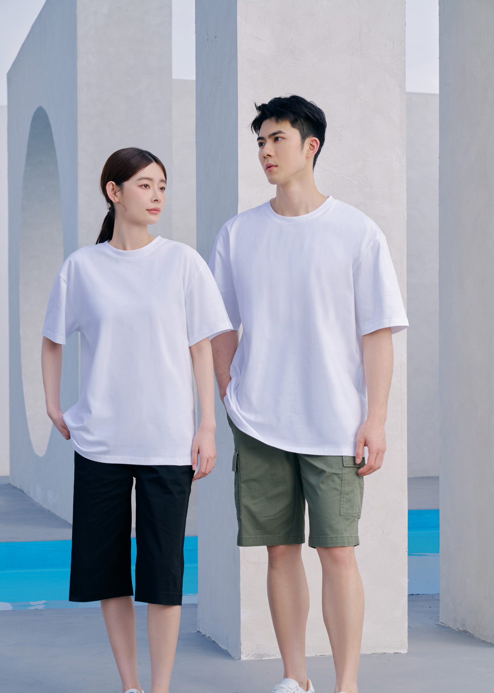 Two people wearing Le'Fonse RC12 relaxed fit round neck cotton t-shirts in white